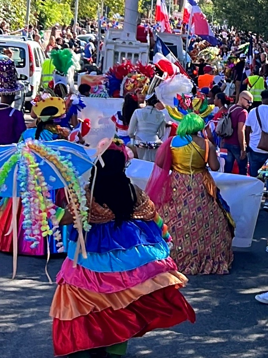 Dominican cultural dancers in colourful traditional costumes.