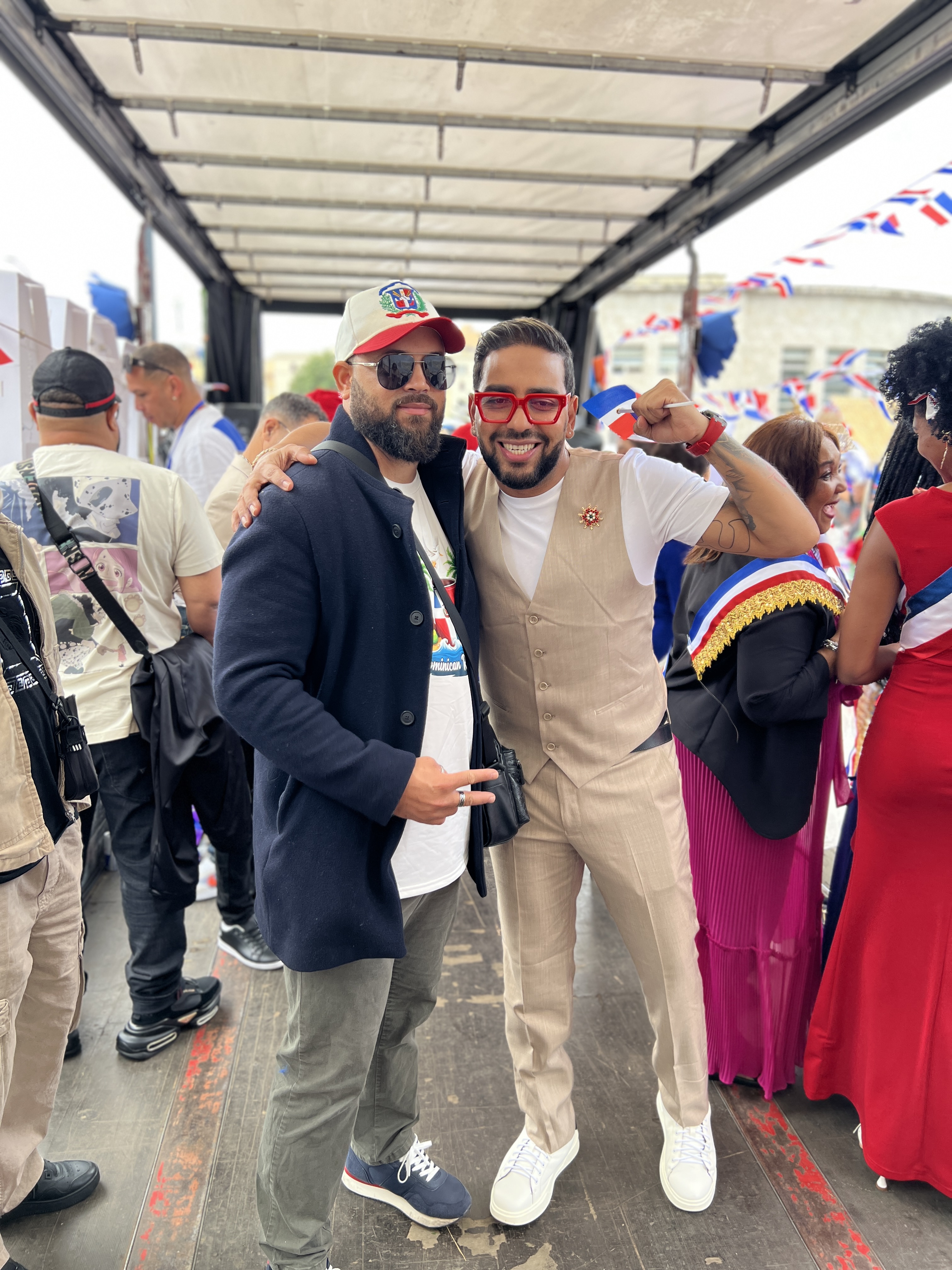 Dominican cultural celebration with guests and flags